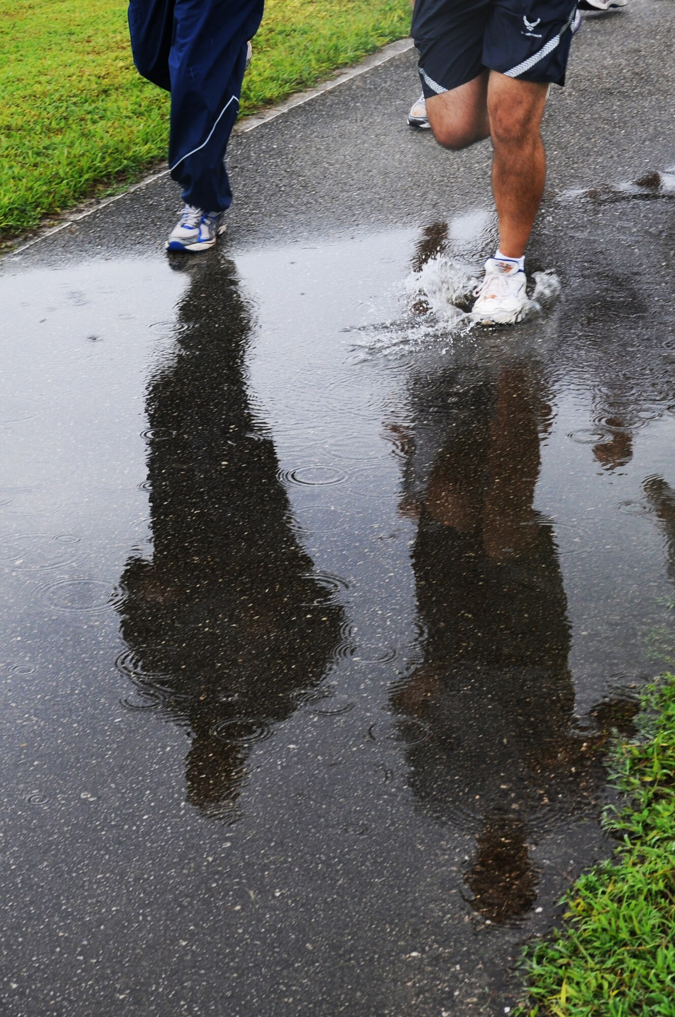 ANDERSEN AIR FORCE BASE, Guam – The reflection of the 36th Communications squadron halfway through the Prisoner of War and Missing in Action memorial run here, Sept. 15. The run lasts 24 hours and was run in one-hour shifts by multiple squadrons. (U.S. Air Force photo/ Senior Airman Carlin Leslie)