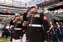 EAST RUTHERFORD, N.J. --  Sgt. Dakota Meyer, stands on the field while his Medal of Honor citation is read during a television time out in the New York Jets vs Jacksonville Jaguars game, at Metlife Stadium, here, Sept 18. Meyer is the only living Marine to be awarded the Medal of Honor for actions since Vietnam. In 2009, he made multiple trips into an intense firefight to try and save members of his team. Meyer recently announced a campaign to He has also issued a "Challenge to America" to match his efforts and raise an additional $1 million to "Honor Marines by Educating their Children."  This challenge allows Americans to help wounded Marines from all conflicts, especially the past 10 years, and forever change their lives by investing in a Marine student's future. For more information visit, www.dakotameyer.com.  (Official Marine Corps photo by Sgt. Randall A. Clinton / RELEASED)