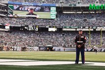 EAST RUTHERFORD, N.J. --  Sgt. Dakota Meyer, stands on the field while his Medal of Honor citation is read during a television time out in the New York Jets vs Jacksonville Jaguars game, at Metlife Stadium, here, Sept 18. Meyer is the only living Marine to be awarded the Medal of Honor for actions since Vietnam. In 2009, he made multiple trips into an intense firefight to try and save members of his team. Meyer recently announced a campaign to He has also issued a "Challenge to America" to match his efforts and raise an additional $1 million to "Honor Marines by Educating their Children."  This challenge allows Americans to help wounded Marines from all conflicts, especially the past 10 years, and forever change their lives by investing in a Marine student's future. For more information visit, www.dakotameyer.com.  (Official Marine Corps photo by Sgt. Randall A. Clinton / RELEASED)