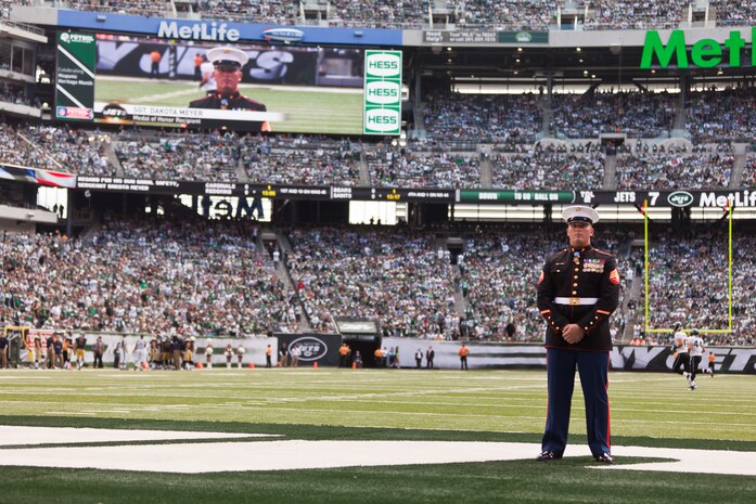 EAST RUTHERFORD, N.J. --  Sgt. Dakota Meyer, stands on the field while his Medal of Honor citation is read during a television time out in the New York Jets vs Jacksonville Jaguars game, at Metlife Stadium, here, Sept 18. Meyer is the only living Marine to be awarded the Medal of Honor for actions since Vietnam. In 2009, he made multiple trips into an intense firefight to try and save members of his team. Meyer recently announced a campaign to He has also issued a "Challenge to America" to match his efforts and raise an additional $1 million to "Honor Marines by Educating their Children."  This challenge allows Americans to help wounded Marines from all conflicts, especially the past 10 years, and forever change their lives by investing in a Marine student's future. For more information visit, www.dakotameyer.com.  (Official Marine Corps photo by Sgt. Randall A. Clinton / RELEASED)