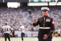 EAST RUTHERFORD, N.J. --  Sgt. Dakota Meyer, stands on the field while his Medal of Honor citation is read during a television time out in the New York Jets vs Jacksonville Jaguars game, at Metlife Stadium, here, Sept 18. Meyer is the only living Marine to be awarded the Medal of Honor for actions since Vietnam. In 2009, he made multiple trips into an intense firefight to try and save members of his team. Meyer recently announced a campaign to He has also issued a "Challenge to America" to match his efforts and raise an additional $1 million to "Honor Marines by Educating their Children."  This challenge allows Americans to help wounded Marines from all conflicts, especially the past 10 years, and forever change their lives by investing in a Marine student's future. For more information visit, www.dakotameyer.com.  (Official Marine Corps photo by Sgt. Randall A. Clinton / RELEASED)