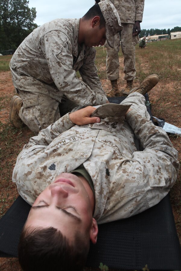 Petty Officer 2nd Class Alejanrdo Pedroza, a hospital corpsman with Combat Logistics Battalion 24, Combat Logistics Regiment 27, 2nd Marine Logistics Group, applies a tourniquet during a simulated mass casualties exercise on Fort Pickett, Va., Sept. 18, 2011. More than 900 Marines and sailors are taking part in the Deployment for Training exercise at Fort Pickett, Sept. 6-23. The battalion is scheduled to attach to the 24th Marine Expeditionary Unit as its battalion landing team a few days after the training.