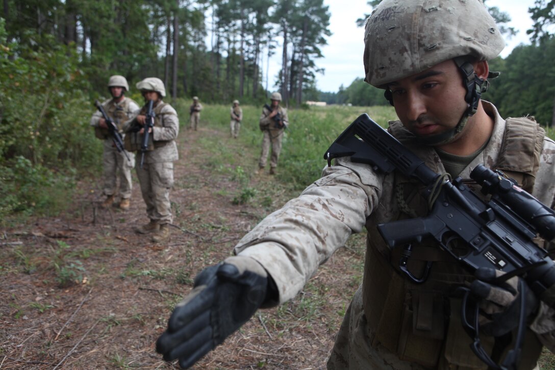 Cpl. Matthew Bear, a motor transportation operator with Combat Logistics Battalion 24, Combat Logistics Regiment 27, 2nd Marine Logistics Group, and El Paso, Texas, native points out an improvised explosive device during an IED lane training exercise on Fort Pickett, Va., Sept. 18, 2011. More than 900 Marines and sailors are taking part in the Deployment for Training exercise at Fort Pickett, Sept. 6-23. The battalion is scheduled to attach to the 24th Marine Expeditionary Unit as its battalion landing team a few days after the training.