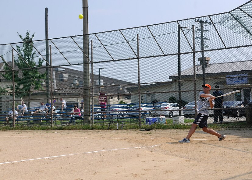 KUNSAN AIR BASE, Republic of Korea -- Col. Scott Pleus, 8th Fighter Wing commander, hits a softball to the left side of the field for a base hit during the Chiefs vs. Eagles softball game here Sept. 17. The chiefs beat the eagles during the rematch 14-7. (U.S. Air Force photo/Staff Sgt. Rasheen A. Douglas)