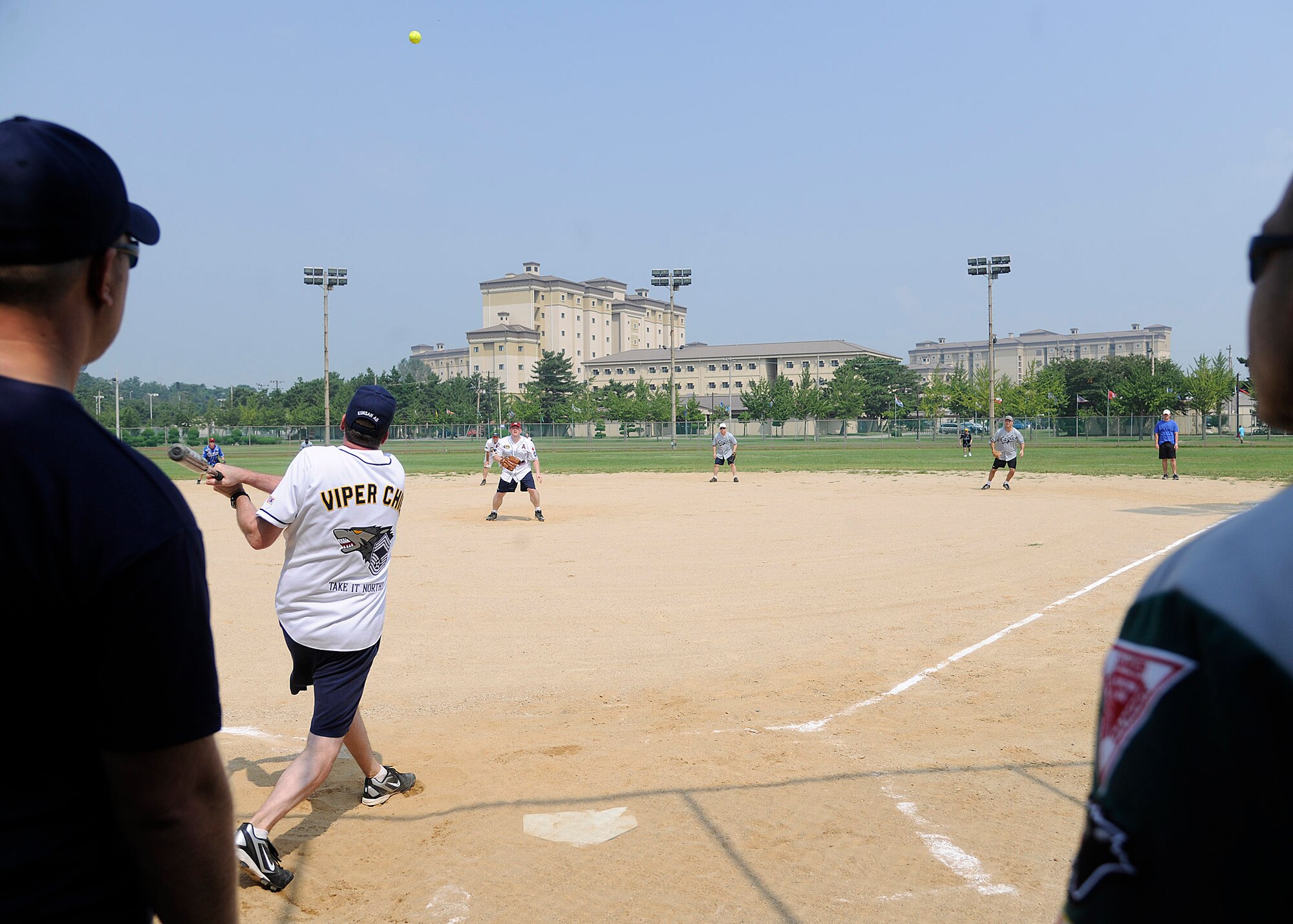 KUNSAN AIR BASE, Republic of Korea -- Chief Master Sgt. Jefferson R. Whited, 8th Operations Group command chief, hits a softball to the left side of the field during the Chiefs vs. Eagles softball game here Sept. 17. The chiefs beat the eagles during the rematch 14-7. (U.S. Air Force photo/Staff Sgt. Rasheen A. Douglas)