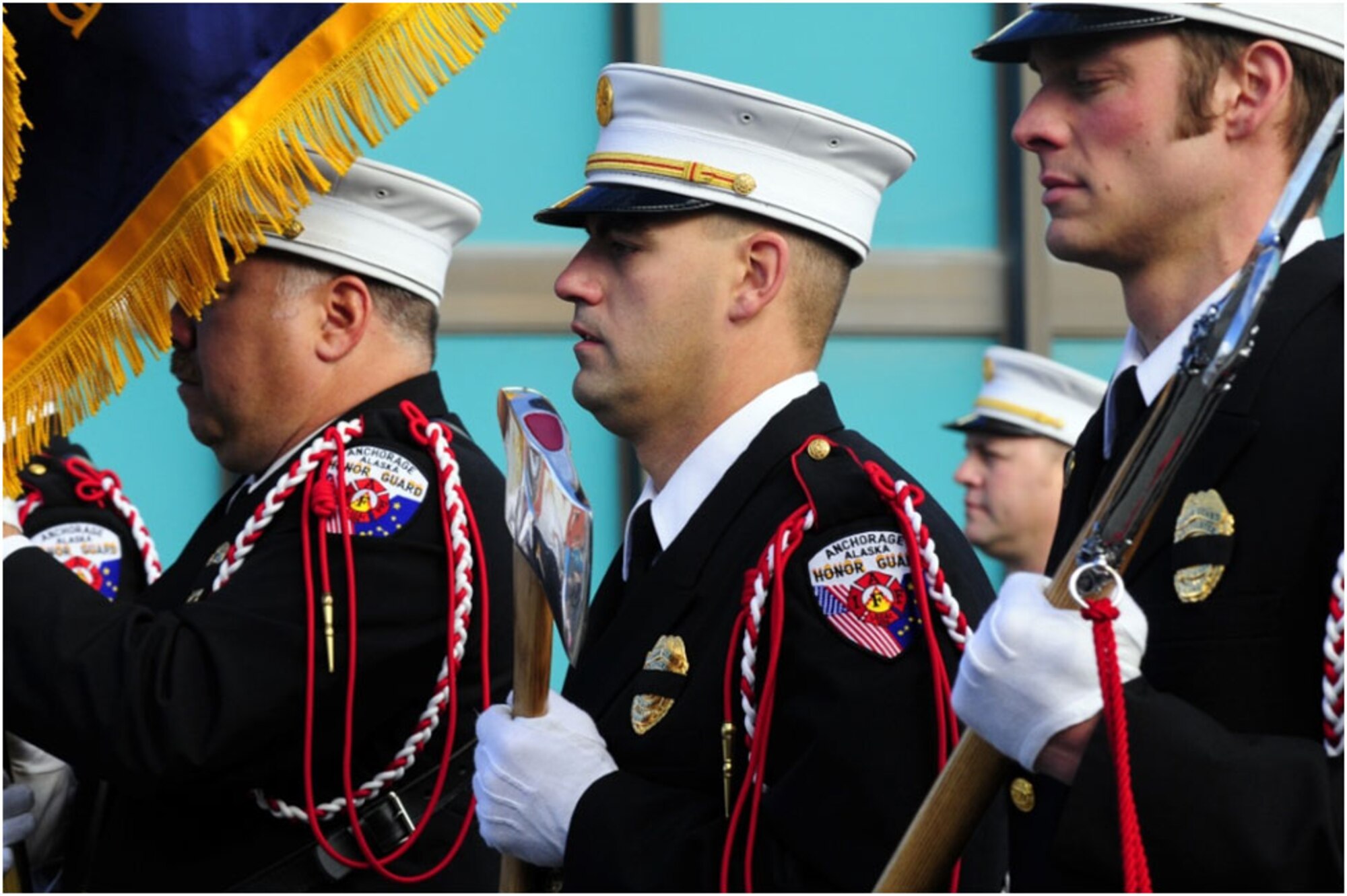 Anchorage -- Members of the Anchorage Fire Department Honor Guard lead a procession of firefighters and engines down 5th Avenue as they head to the Alaska Fallen Firefighter Memorial. (U.S. Air Force photo/Percy Jones)