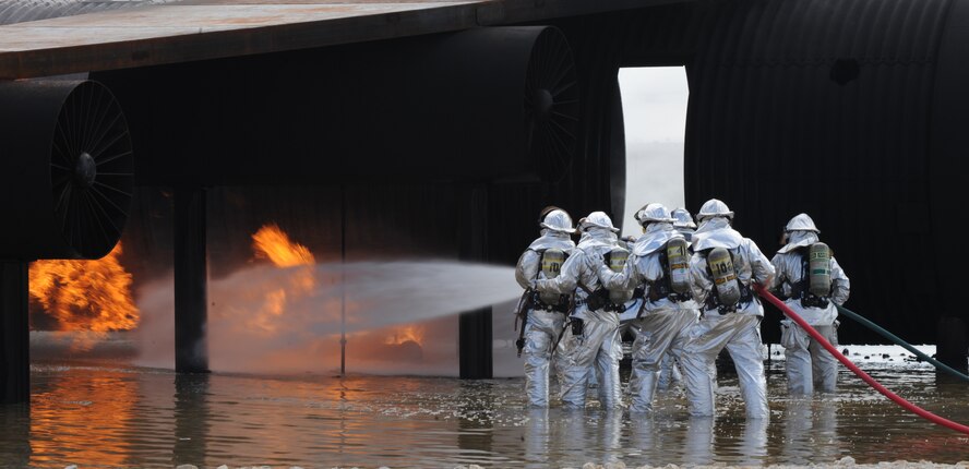 Dyess , Abilene Regional airport (ABI) and Abilene Fire Department firefighters team up to extinguish an aircraft fire during a joint training exercise at Dyess Air Force Base, Texas,  Sept. 16, 2011. Firefighters from ABI are required by the Federal Aviation Association (FAA) to be proficient in extinguishing aircraft fires. By inviting them onto the base, Dyess firefighters facilitate a means to achieve their annual training and foster a working relationship. (U.S. Air Force Photo by Airman 1st Class Cierra Bullock/Released) 