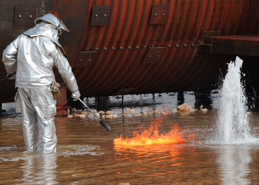 Dyess , Abilene Regional airport (ABI) and Abilene Fire Department firefighters team up to extinguish an aircraft fire during a joint training exercise at Dyess Air Force Base, Texas,  Sept. 16, 2011. Firefighters from ABI are required by the Federal Aviation Association (FAA) to be proficient in extinguishing aircraft fires. By inviting them onto the base, Dyess firefighters facilitate a means to achieve their annual training and foster a working relationship. (U.S. Air Force Photo by Airman 1st Class Cierra Bullock/Released) 