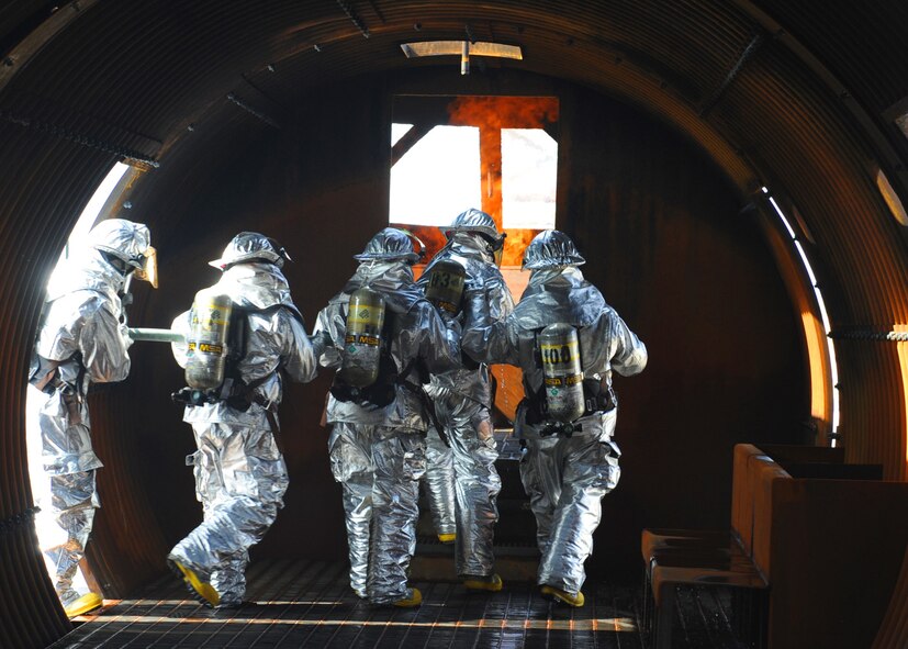 Dyess , Abilene Regional airport (ABI) and Abilene Fire Department firefighters team up to extinguish an aircraft fire during a joint training exercise at Dyess Air Force Base, Texas,  Sept. 16, 2011. Firefighters from ABI are required by the Federal Aviation Association (FAA) to be proficient in extinguishing aircraft fires. By inviting them onto the base, Dyess firefighters facilitate a means to achieve their annual training and foster a working relationship. (U.S. Air Force Photo by Airman 1st Class Cierra Bullock/Released) 