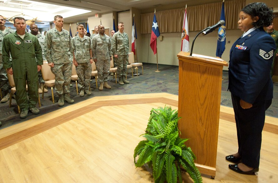 U.S. Air Force Staff Sgt. Alicia Tucker, 23rd Medical Operations Squadron aerospace medical technician, sings the national anthem during the 64th Air Force birthday celebration at Moody Air Force Base, Ga., Sept. 16, 2011. Various members of the Moody community took part in the event to reflect on Air Force history. (U.S. Air Force photo by Airman 1st Class Paul Francis/Released)
