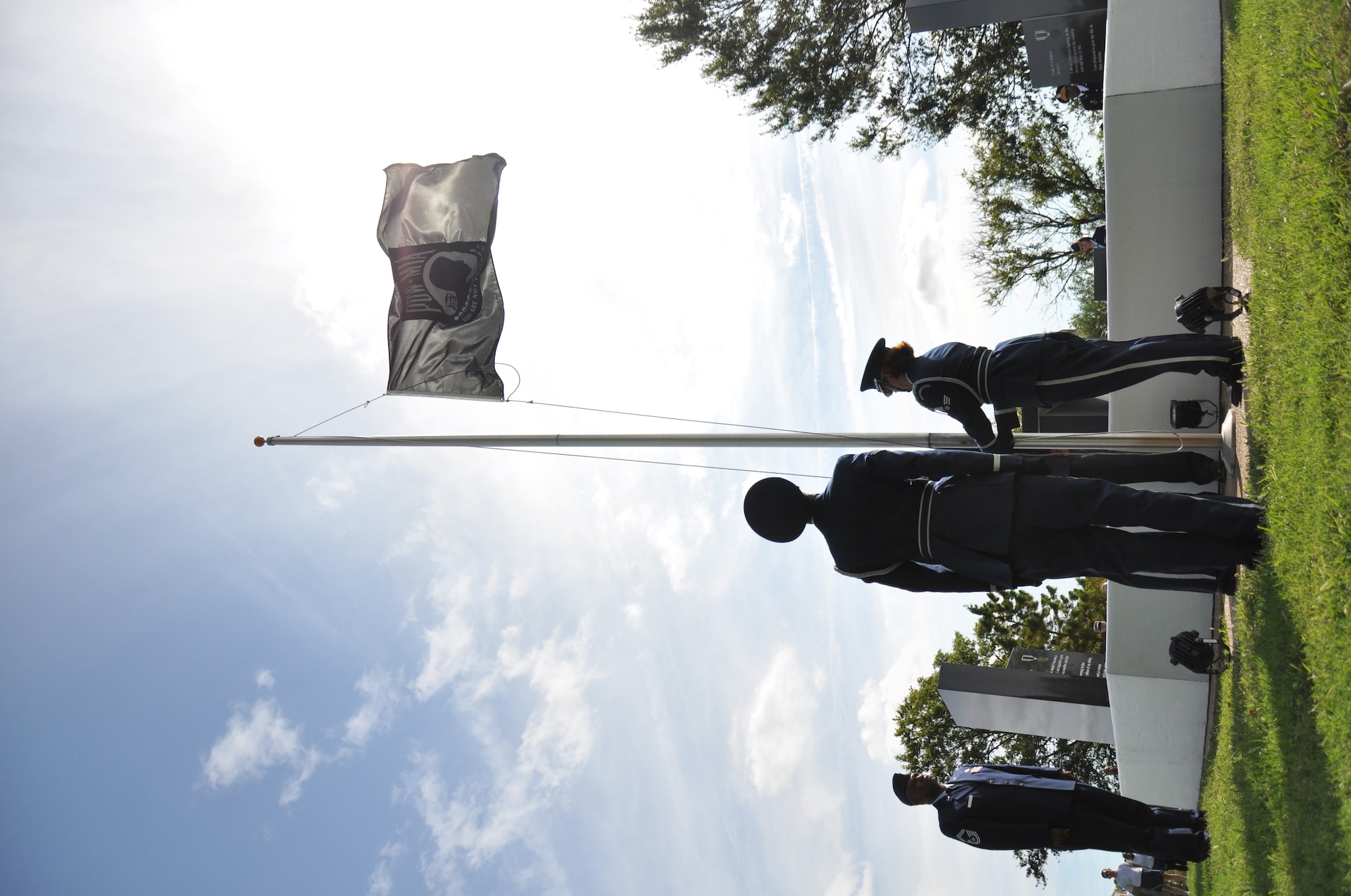 Airmen from the Langley Air Force Base Honor Guard raise the Prisoners of War/Missing in Action Flag during the Joint Base Langley-Eustis National POW/MIA Recognition Day Ceremony Sept. 16, 2011. More than 40 guests attended the ceremony, which included a speech by former POW and retired Navy Cmdr. Paul E. Galanti. (U.S. Air Force photo by Senior Airman Jason J. Brown/RELEASED)