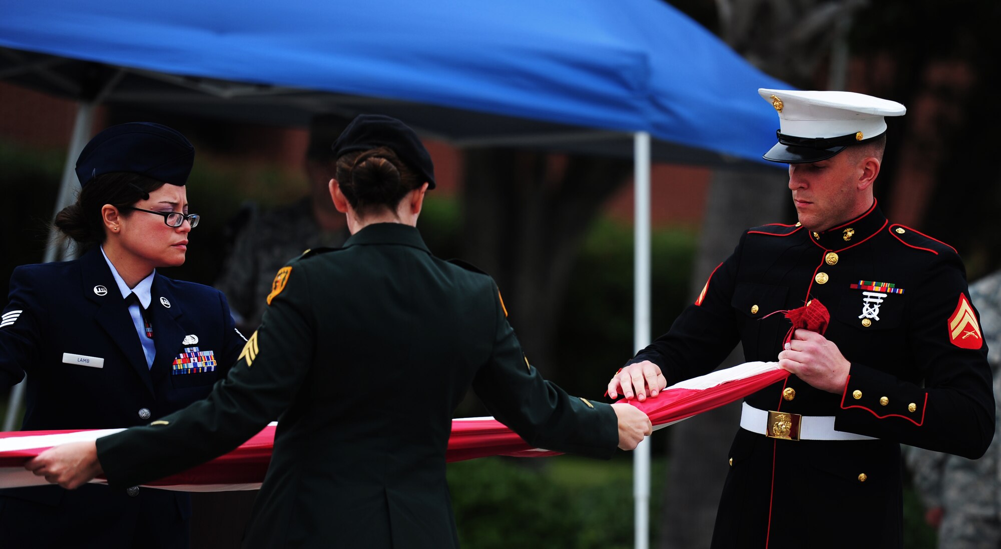 Members of Joint Base Charleston fold the flag during the Prisoner of War/Missing in Action Retreat Ceremony on September 16, 2011, Joint Base Charleston, S.C.  Team Charleston honored POW/MIA rememberance d Base ay with a 24-hour run that ended at the retreat ceremony followed by a wreath laying and a fly-over.  Former POW's were in attendance.  (U.S. Air Force photo/ Staff Sgt. Nicole Mickle) (RELEASED)  