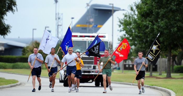 Senior Enlisted Leadership from each of the military branches run the last leg of the 24 hour POW/MIA rememberance run that ended at the  Retreat Ceremony on September 16, 2011, Joint Base Charleston, S.C.  Joint Base Charleston honored POW/MIA rememberance day with a 24-hour run that ended at the retreat ceremony followed by a wreath laying and a fly-over.  Former POW's as well as members of Joint Base Charleston were in attendance.    (U.S. Air Force photo/ Staff Sgt. Nicole Mickle) (RELEASED)  