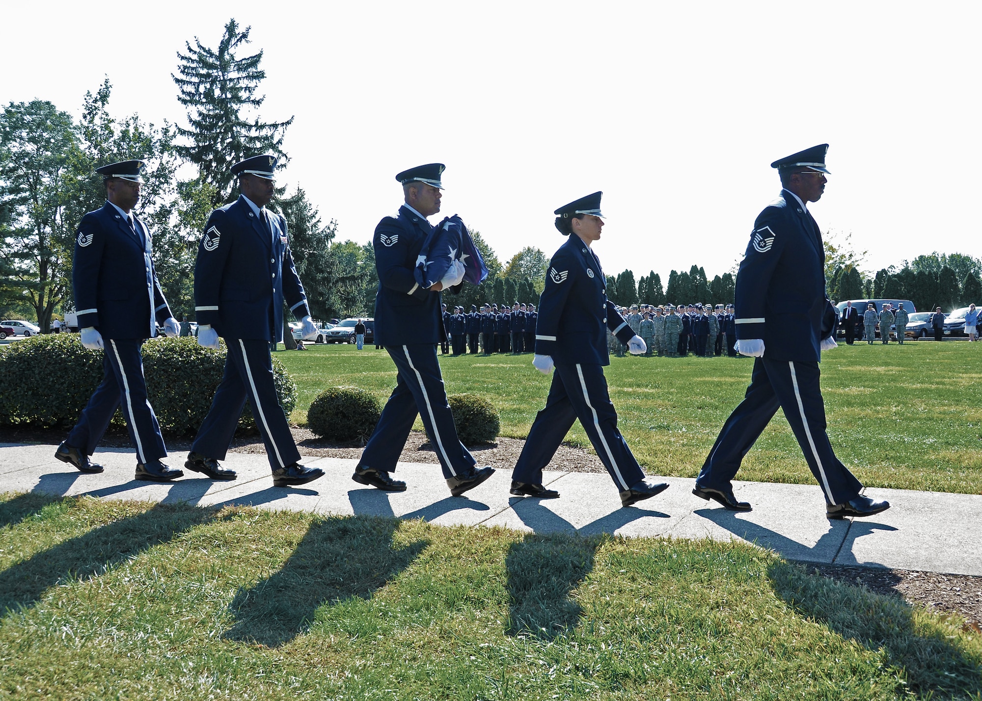 WRIGHT-PATTERSON AIR FORCE BASE, Ohio – Wright-Patterson AFB Honor Guard carries the flag away for the evening after retreat Sept. 15. Wright-Patt honored National POW/MIA Recognition Day with a wreath laying ceremony at the Arnold House prior to the retreat. The retreat was held that the 88th Air Base Wing Headquarters flagpole. (U.S. Air Force photo/Senior Airman Mikhail Berlin)