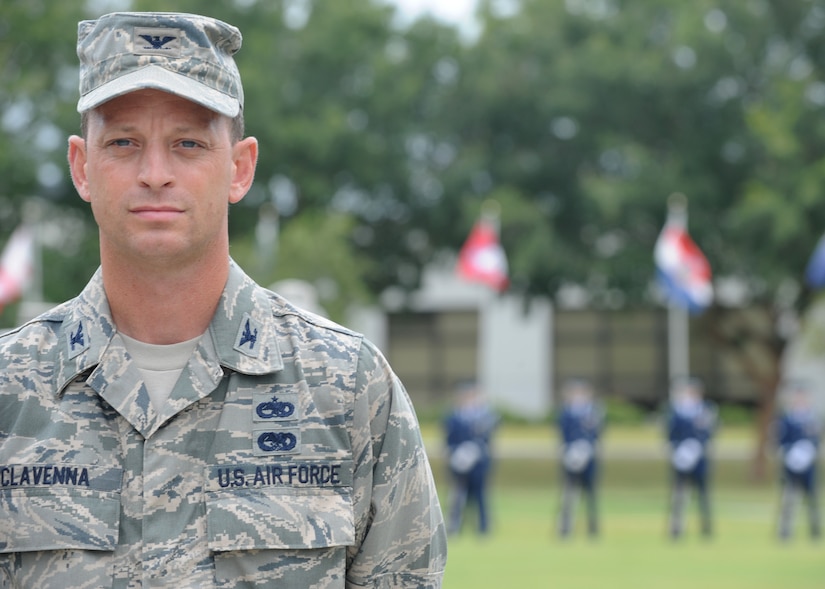 Colonel James Clavenna stands are parade rest prior to the start of the Prisoner of War/Missing in Action retreat ceremony. The ceremony included participation from various groups around Joint Base Charleston, a 21 gun salute by the Honor Guard, wreath laying and music from a bag pipes player for recognition to captured, killed in action and missing comrades from the Armed Services. Col. Clavenna is the 437th Maintenance Group commander.  (U.S. Air Force photo/Staff Sgt. Katie Gieratz) (Released)