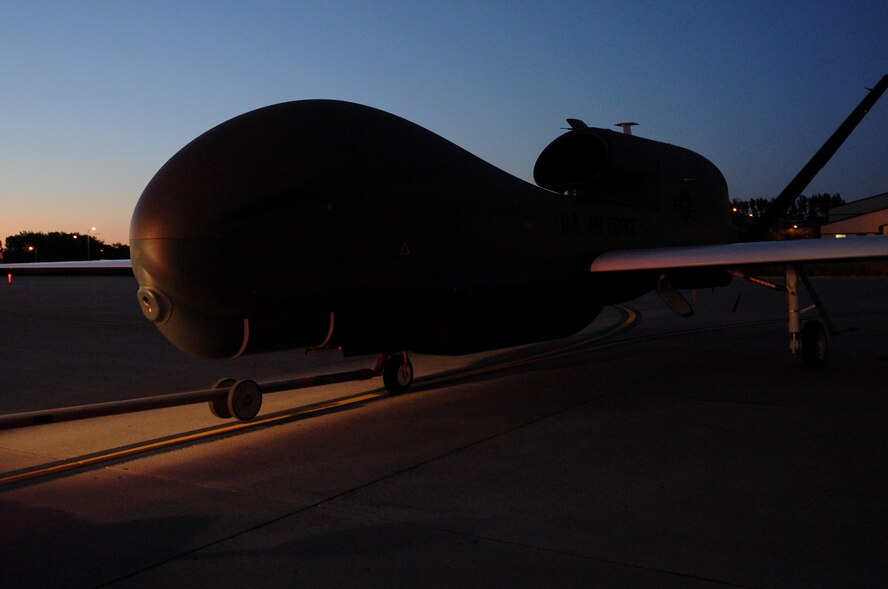 A RQ-4 Global hawk is moved on the flight line on Grand Forks Air Force Base Sept. 19. The Global Hawk covers intelligence collection capability to support forces in worldwide peace, crisis, and wartime operations. The capabilities of the aircraft allow more precise targeting of weapons and better protection of forces through superior surveillance capabilities. (U.S. Air Force photo by Senior Airman Amanda N. Stencil)