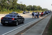 Lowndes County Sheriff’s Office deputies escort runners from the 23rd Wing the third annual Tiger-thon in Valdosta, Ga., Sept. 16, 2011. Individuals from different organizations joined together to run one-mile increments to honor POW/MIA during the event. (U.S. Air Force photo by Senior Airman Ciara Wymbs/Released) 