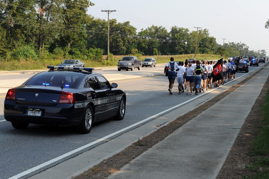 Lowndes County Sheriff’s Office deputies escort runners from the 23rd Wing the third annual Tiger-thon in Valdosta, Ga., Sept. 16, 2011. Individuals from different organizations joined together to run one-mile increments to honor POW/MIA during the event. (U.S. Air Force photo by Senior Airman Ciara Wymbs/Released) 