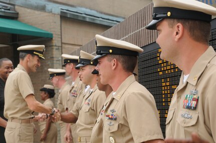 Captain Ralph Ward congratulates the new chief petty officers after the FY12 Chief Petty Officer Pinning Ceremony held at Joint Base Charleston - Weapons Station Sept. 16. (U.S. Navy photo/Mass Communication Specialist 1st Class Jennifer Hudson)