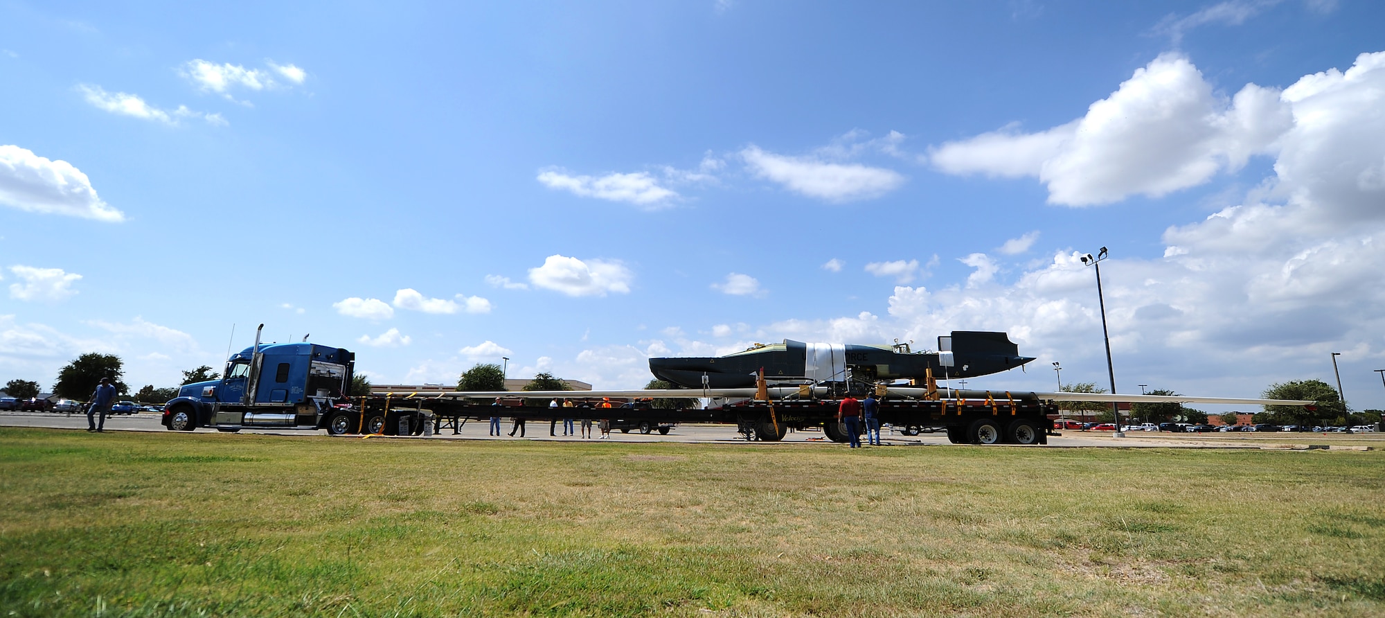GOODFELLOW AIR FORCE BASE, Texas -- The dismantled RQ-4 Global Hawk sits upon a flat bed trailer, hauled by a semi truck Sep. 16. This unmanned aerial surveillance vehicle is the first of its kind to be used as a static display. (U.S. Air Force photo/Airman 1st Class Michael Smith)