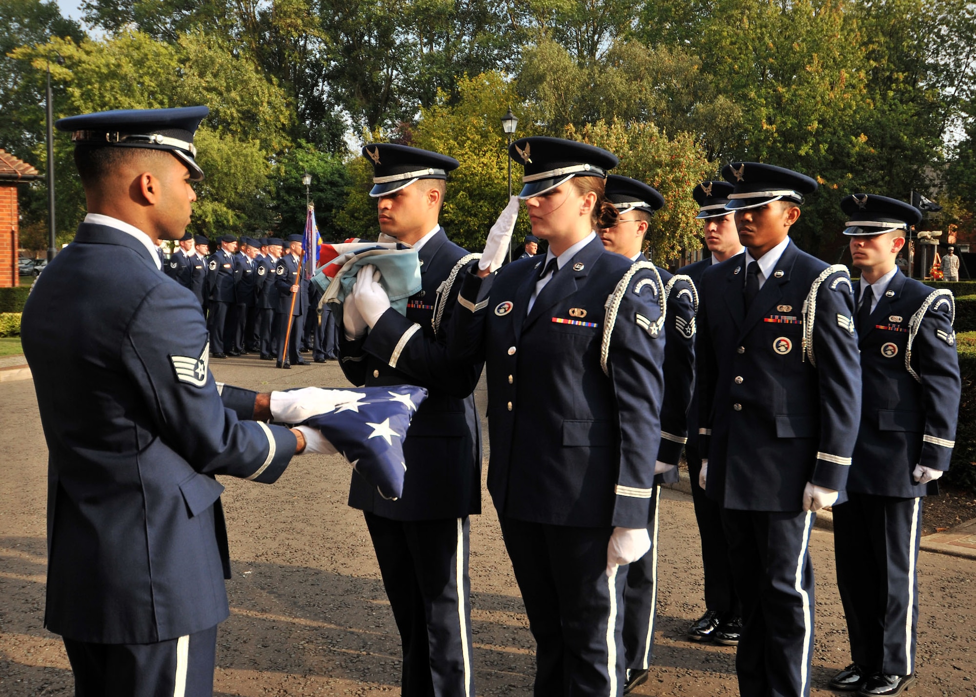 RAF MILDENHALL, England – Airman 1st Class Michelle Bonham, honor guard member, renders a ceremonial salute to the flag during a special retreat ceremony in honor of Prisoner of War/Missing in Action Remembrance week here Sept. 16, 2011. Every year during the third week of September, events pay special tribute to America’s POW/MIA servicemen and women remembering the sacrifices they’ve made for their country. (U.S. Air Force photo by Senior Airman Jerilyn Quintanilla)