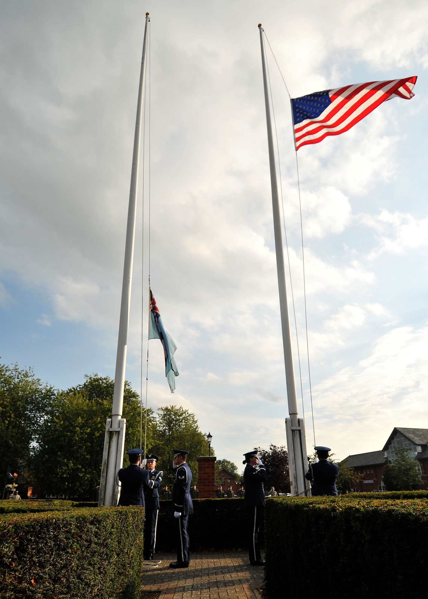 RAF MILDENHALL, England – The base honor guard lowers the flag during a special retreat ceremony in honor of Prisoner of War/Missing in Action Remembrance week here Sept. 16, 2011. POW/MIA week is a time for the nation to pay respect to the men and women of America who sacrificed in the defense of their country. (U.S. Air Force photo by Senior Airman Jerilyn Quintanilla)