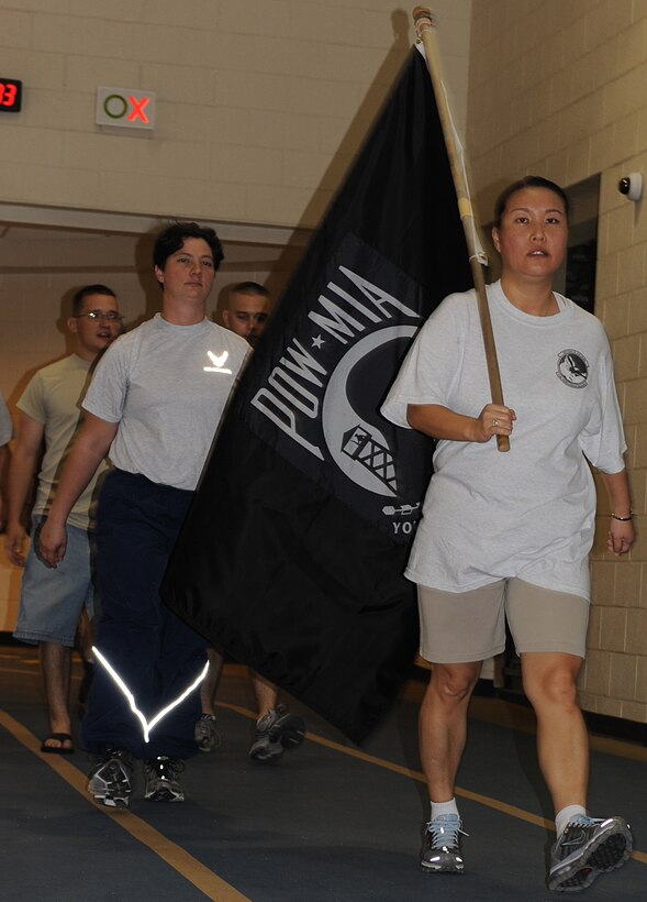 U.S. Air Force Master Sgt. Amanda Wood, 718th Intel Squadron Alpha flight chief, leads the pack during the POW/MIA 24 Hour Run/Walk Vigil at Langley Air Force Base, Va., Sept. 15, 2011. Approximately 350 runners and walkers volunteered to keep the POW/MIA flag continuously moving for 24 hours. (U.S. Air Force photo by Airman 1st Class Teresa Cleveland/Released)