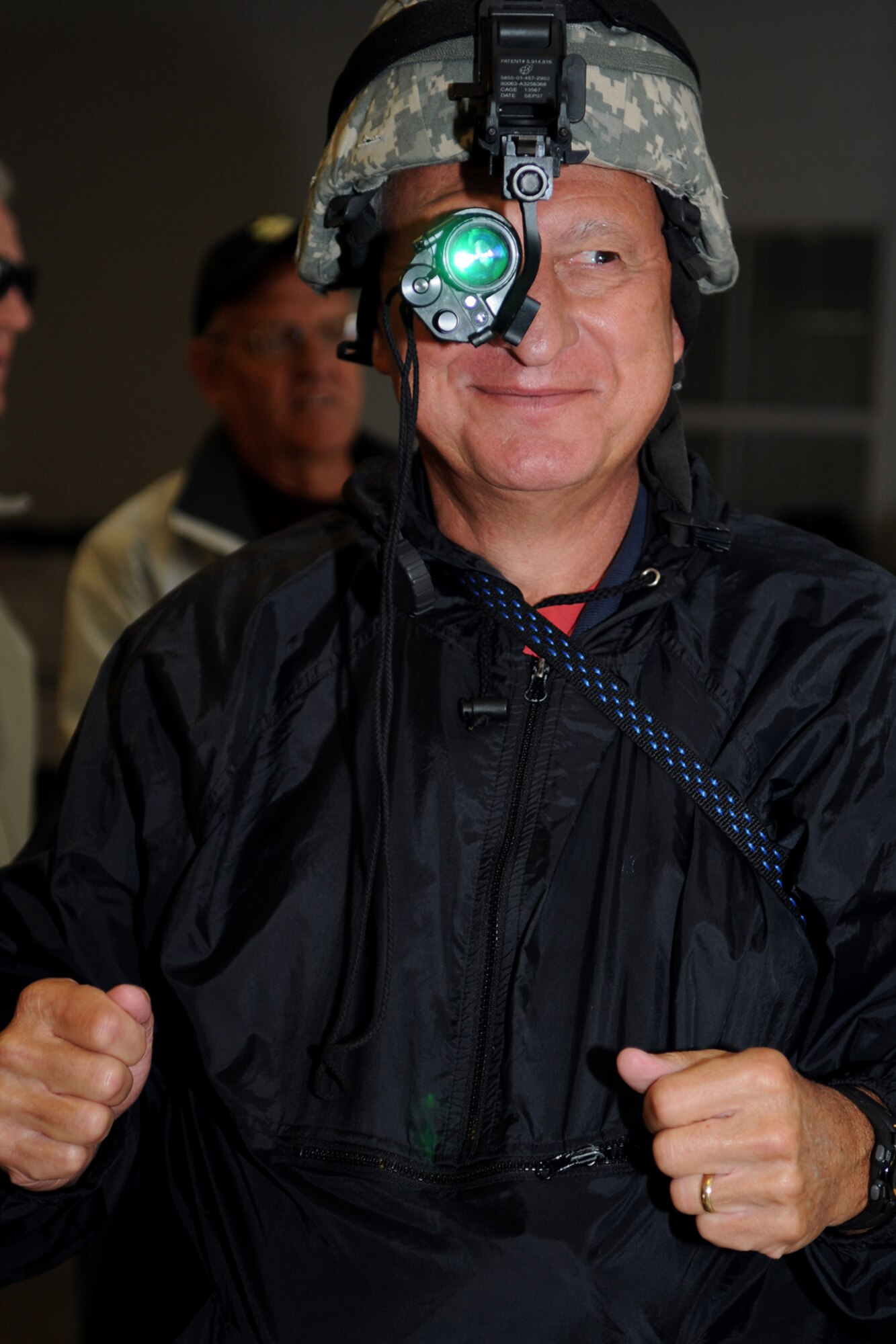 GRISSOM AIR RESERVE BASE, Ind. -- Jerry Uranker, a member of the Britton Falls Veterans group, tries on a night vision helmet at the U.S. Army reserve's 316th Tactical Psychological Operations Company here Sept. 7. The group toured the base to learn about the history and involvement that Grissom plays not only for the Air Force, but in the surrounding community. (U.S. Air Force photo/Senior Airman Jami K. Lancette)
