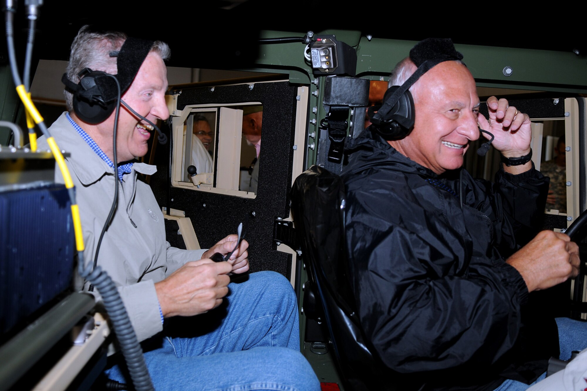GRISSOM AIR RESERVE BASE, Ind. -- Greg Zolezzi and Jerry Uranker, members of the Britton Falls Veterans group, share a laugh as they sit in the Humvee at the U.S. Army reserve's 316th Tactical Psychological Operations Company here Sept. 7. The group toured Grissom to gain perspective on the operations of the base and the role it has not only in the military, but in the surrounding community. (U.S. Air Force photo/Senior Airman Jami K. Lancette)
