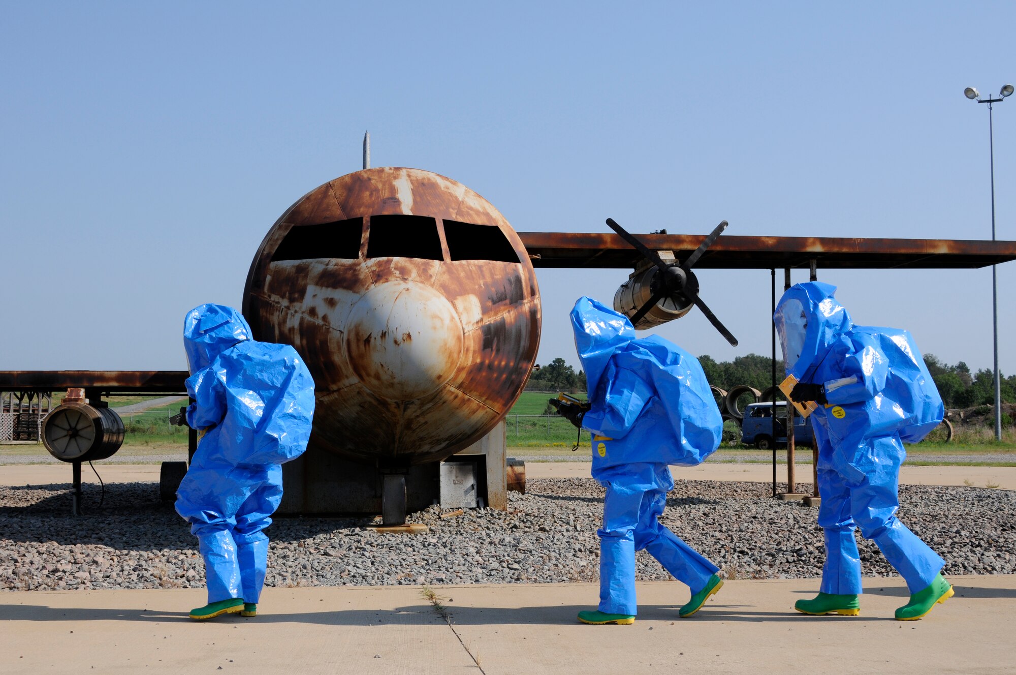 Emergency managers use specialized equipment to test an unknown substance during a National Guard Bureau deployed field training hazardous material technician and CBRN special tactics and response course hosted by the 188th Fighter Wing’s Emergency Management Flight at the unit’s Fire Training Site Aug. 14-27. (U.S. Air Force photo by Senior Master Sgt. Dennis Brambl/188th Fighter Wing Public Affairs)