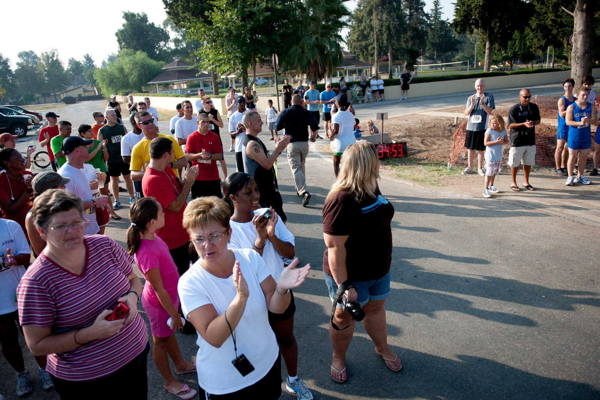 Participants and spectators watch runners finishing the half marathon Sept. 17, 2011, at Incirlik Air Base, Turkey. More than 80 runners participated in the 13.1 mile race that coincided with the annual Air Force Marathon. (U.S. Air Force photo by Tech. Sgt. Michael B. Keller/Released)