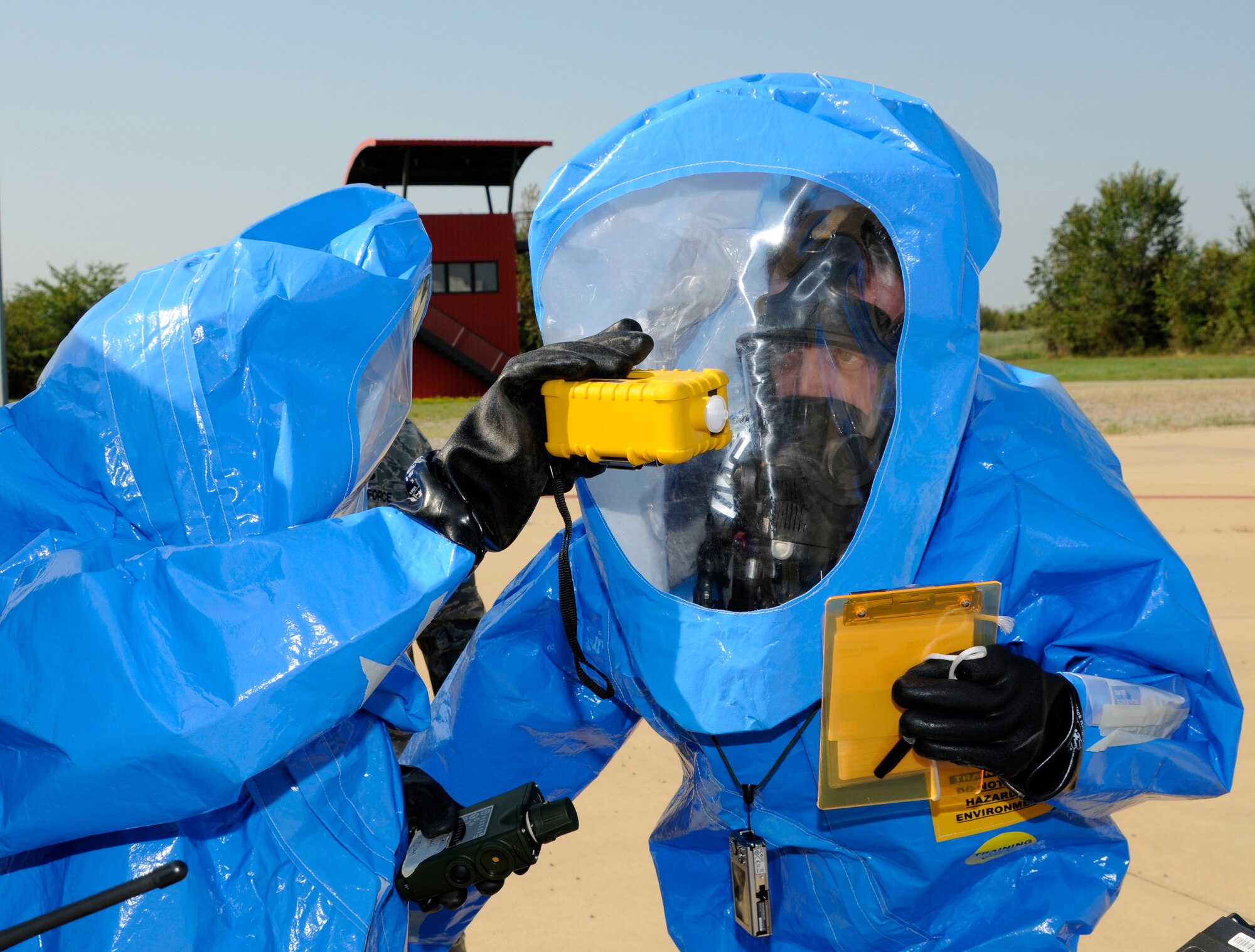Emergency managers use specialized equipment to test an unknown substance during a National Guard Bureau deployed field training hazardous material technician and CBRN special tactics and response course hosted by the 188th Fighter Wing’s Emergency Management Flight at the unit’s Fire Training Site Aug. 14-27. (U.S. Air Force photo by Senior Master Sgt. Dennis Brambl/188th Fighter Wing Public Affairs)