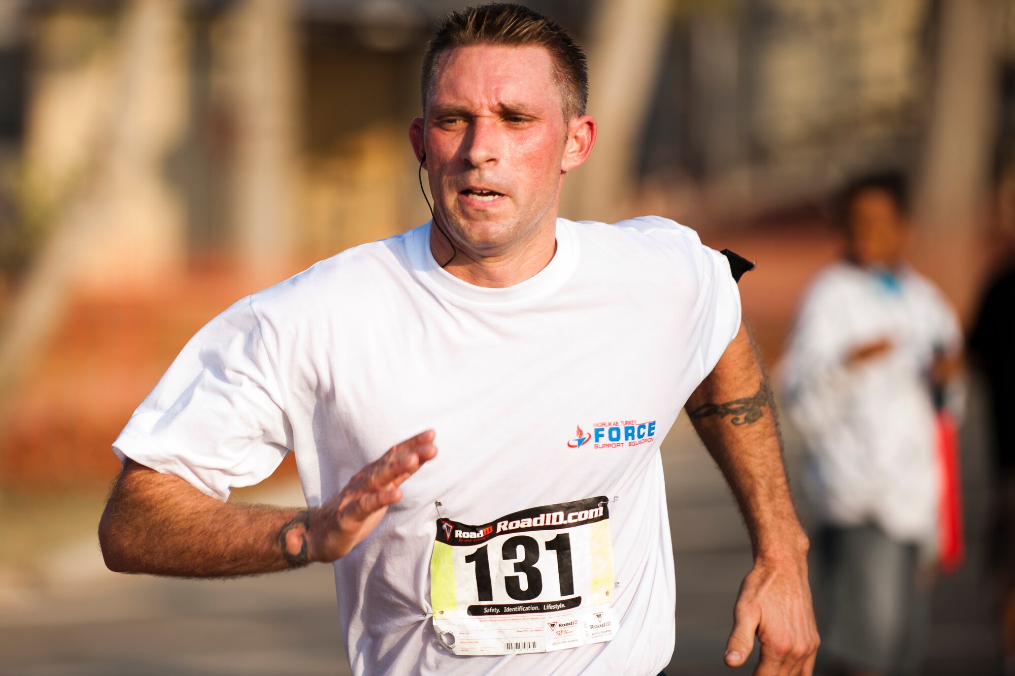 Troy Davidson, 39th Communications Squadron, sprints to the finish of the half marathon Sept. 17, 2011, at Incirlik Air Base, Turkey. More than 80 runners participated in the 13.1 mile race that coincided with the annual Air Force Marathon. Davidson finished the run in 1:45:38. (U.S. Air Force photo by Tech. Sgt. Michael B. Keller/Released)