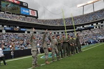 Aircrew and maintainers from the 916th Air Refueling Wing, Air Force Reserve, were recognized on the field at half-time for their pre-game flyover during the Carolina Panthers home opener on Sunday, Sept. 18. This was the first time a KC-135R has flown over the stadium for an NFL game. (USAF photo by Master Sgt. Wendy Lopedote, 916ARW/PA)
