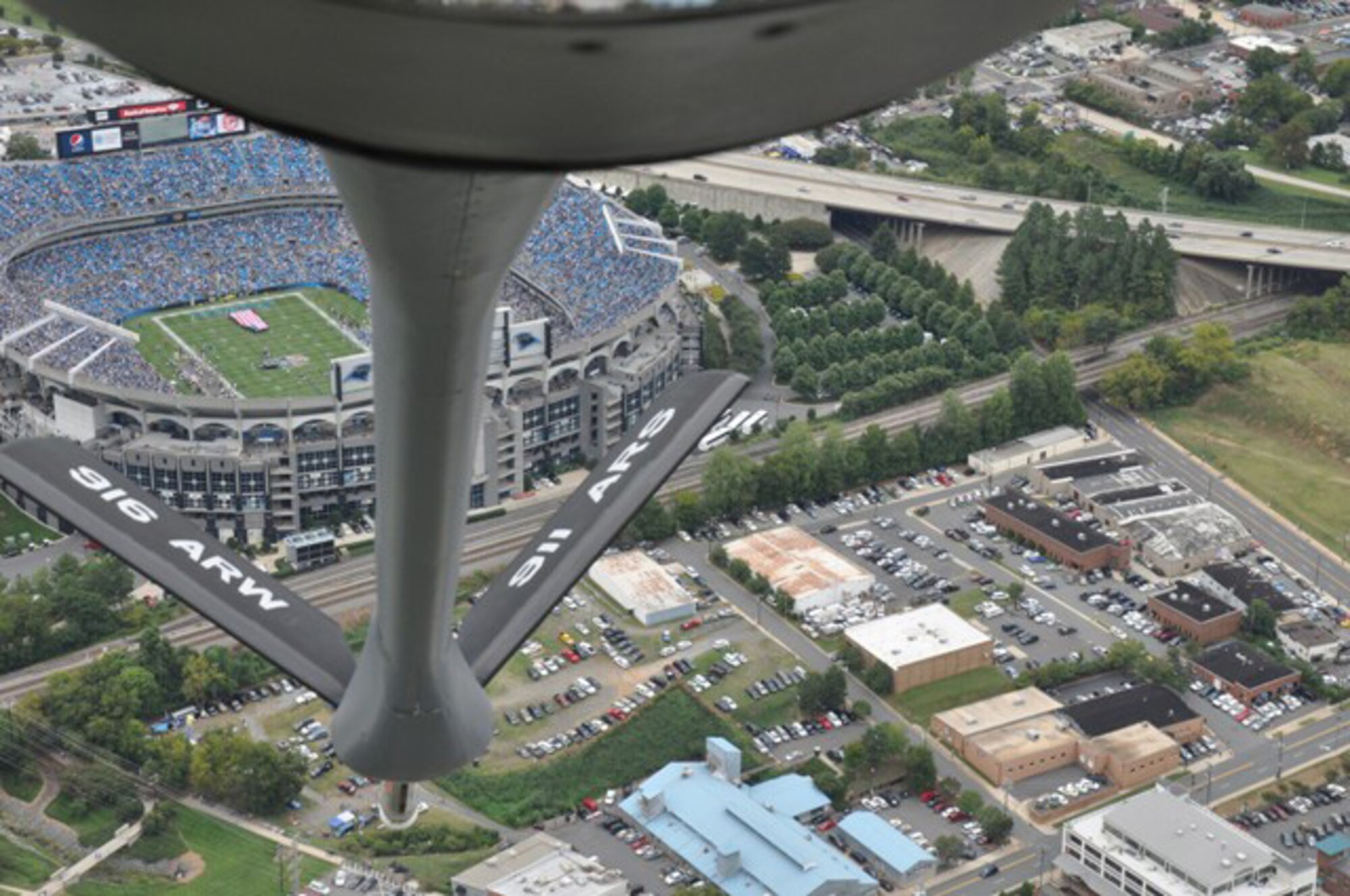 A KC-135R from the 916th Air Refueling Wing, Air Force Reserve, flies over the Bank of America Stadium in Charlotte as part of the Carolina Panthers home-opener against the Green Bay Packers. The aircrew and maintainers aboard were recognized on the field during the half-time show. (USAF photo by Master Sgt. Wendy Lopedote, 916ARW/PA)