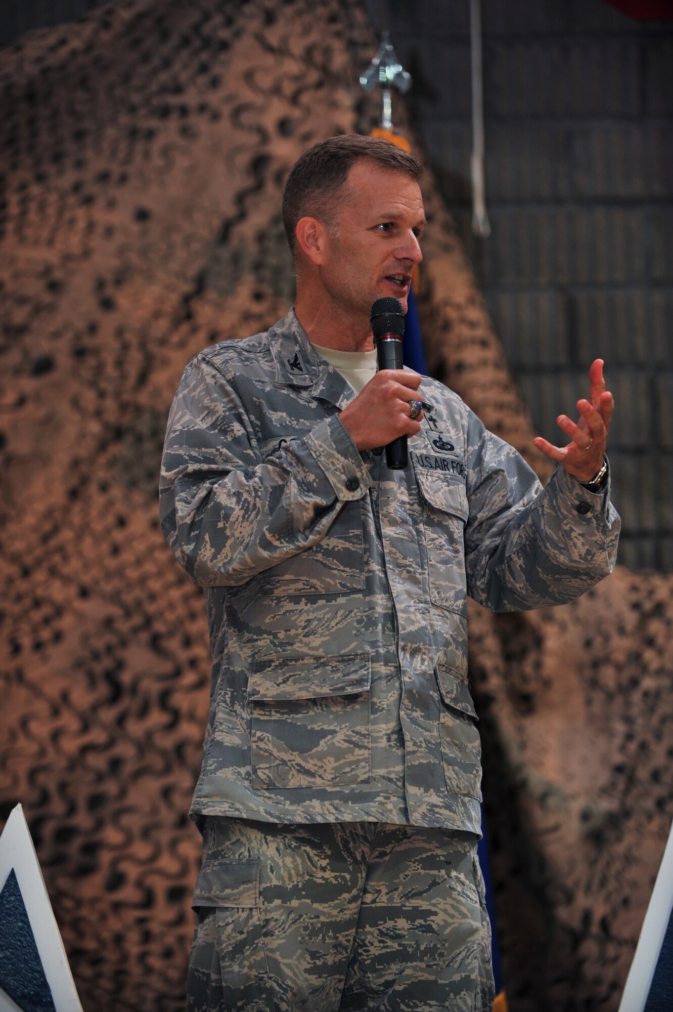 Chaplain (Col.) Dondi Costin, U.S. Air Forces Central Command chaplain, speaks to deployed servicemembers during a 64th Air Force birthday dinner, Sept. 18, 2011, at an undisclosed location in Southwest Asia. (U.S. Air Force photo/Senior Airman Paul Labbe)