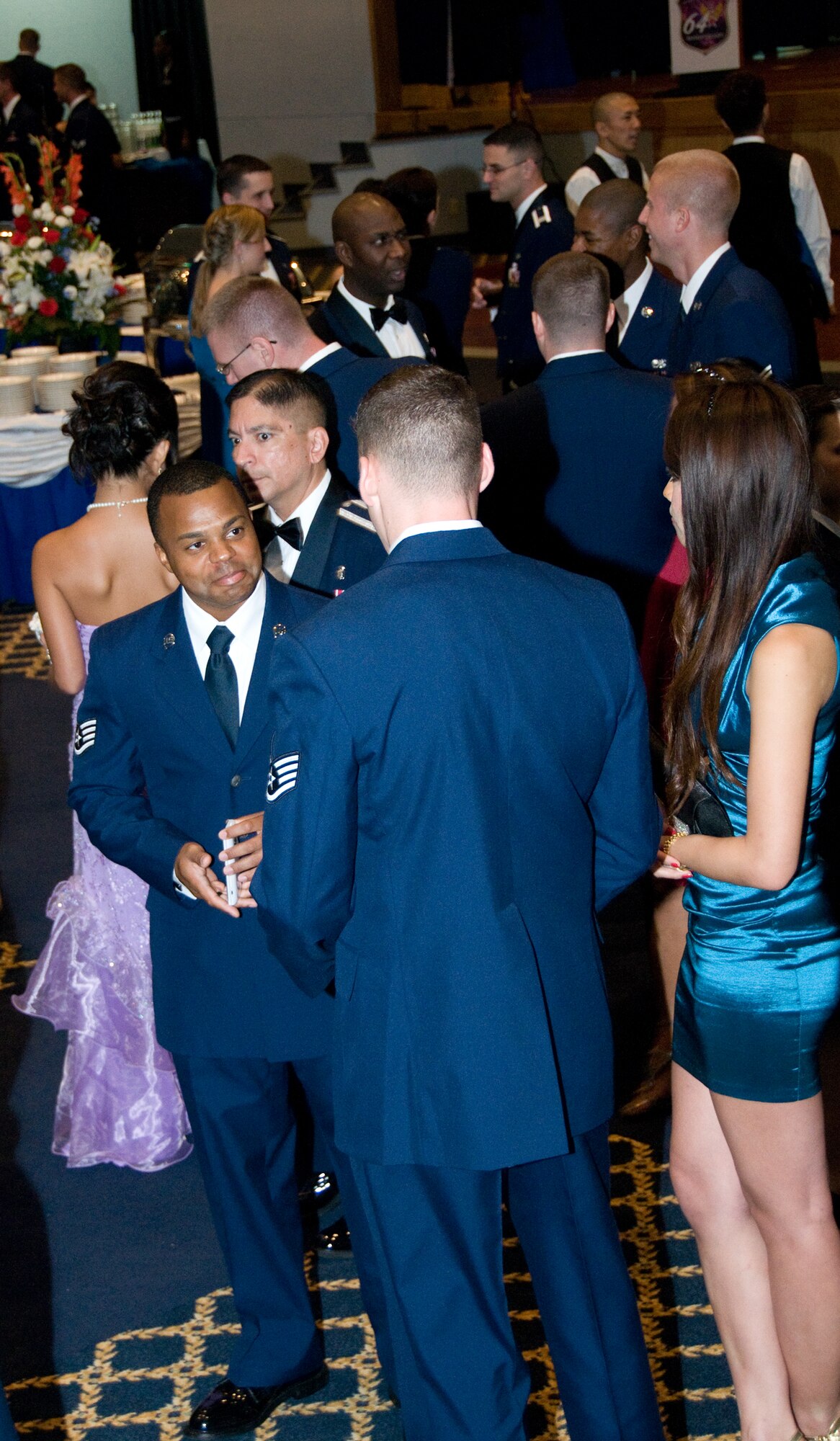YOKOTA AIR BASE, Japan -- Airmen mingle while enjoying beverages, food and music during the Air Force Ball at Yokota Air Base, Japan, Sept. 17, 2011 This year's ball marked the 64th Anniversary of the U.S. Air Force and commemorated its heritage. (U.S. Air Force photo/Airman 1st Class Krystal M. Garrett) 