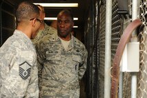 KUNSAN AIR BASE, Republic of Korea -- Master Sgt. Samuel Figueroa, 8th Security Forces Squadron kennel master, briefs Brig. Gen. Jimmy McMillian, Director of Security Forces, Deputy Chief of Staff for Logistics, Installations and Mission Support, Headquarters U.S. Air Force, Washington, D.C., on kennel operations here Sept. 13. McMillian is the focal point for ensuring the physical security of nuclear assets within the Air Force and planning and programming for more than 30,000 active-duty and Reserve components security forces at locations worldwide. (U.S. Air Force photo/Senior Airman Brittany Y. Bateman)