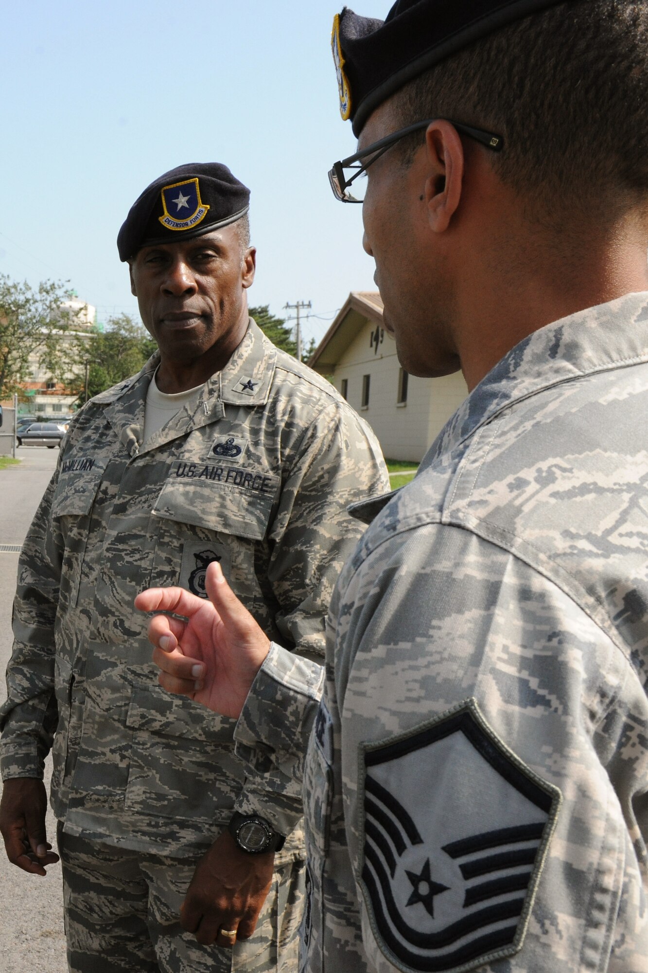 KUNSAN AIR BASE, Republic of Korea -- Master Sgt. Samuel Figueroa, 8th Security Forces Squadron kennel master, briefs Brig. Gen. Jimmy McMillian, Director of Security Forces, Deputy Chief of Staff for Logistics, Installations and Mission Support, Headquarters U.S. Air Force, Washington, D.C., on kennel operations here Sept. 13. McMillian is the focal point for ensuring the physical security of nuclear assets within the Air Force and planning and programming for more than 30,000 active-duty and Reserve components security forces at locations worldwide. (U.S. Air Force photo/Senior Airman Brittany Y. Bateman)

