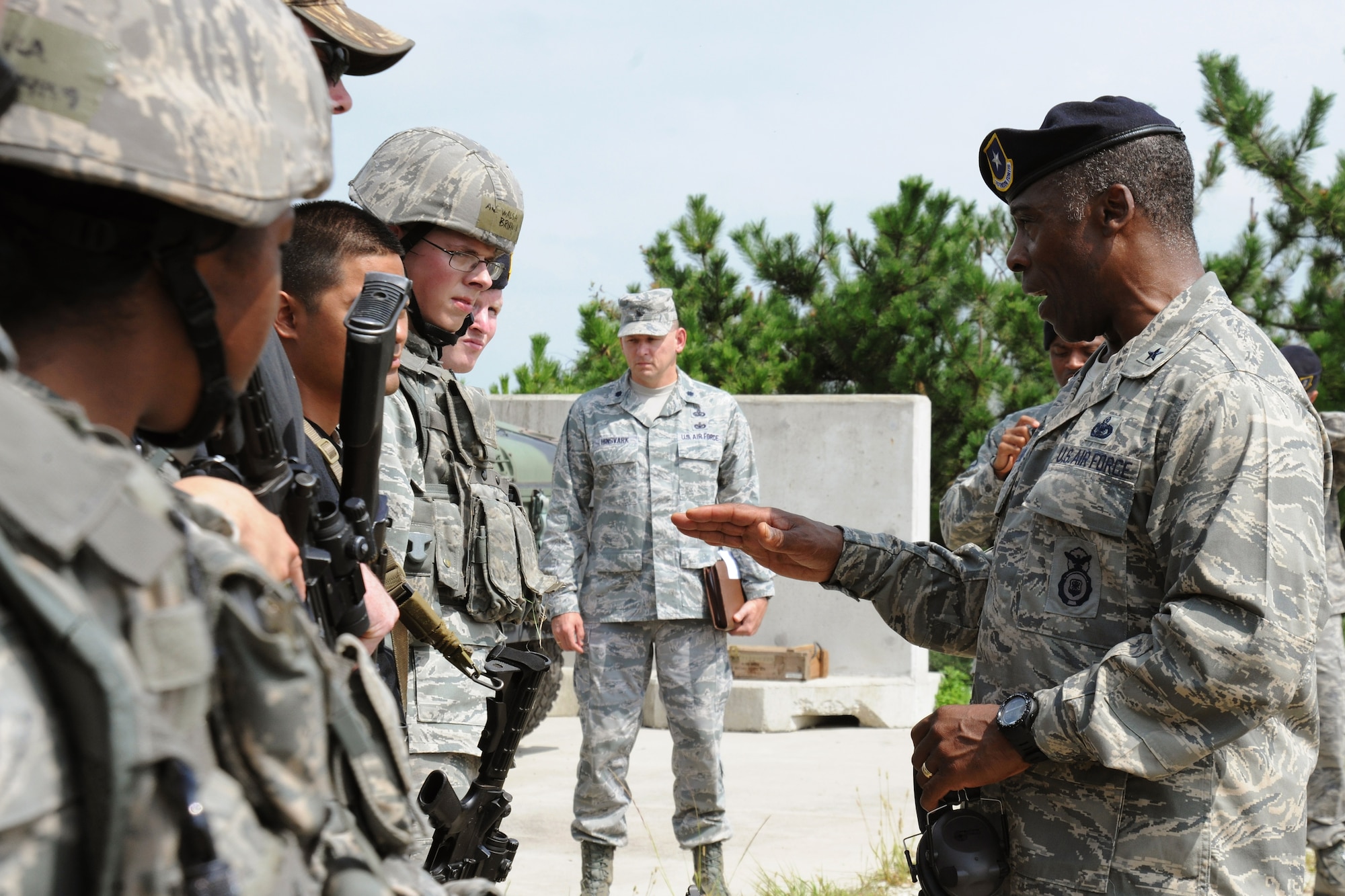KUNSAN AIR BASE, Republic of Korea -- Brig. Gen. Jimmy McMillian, Director of Security Forces, Deputy Chief of Staff for Logistics, Installations and Mission Support, Headquarters U.S. Air Force, Washington, D.C., speaks with members of the 8th Security Forces Squadron here Sept. 13. McMillian provides policy and oversight for protecting Air Force resources from terrorism, criminal acts, sabotage and acts of war and he ensures security forces members are trained, equipped and ready to support contingency and exercise plans. (U.S. Air Force photo/Senior Airman Brittany Y. Bateman)

