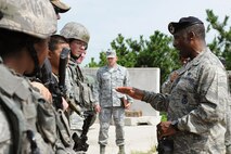 KUNSAN AIR BASE, Republic of Korea -- Brig. Gen. Jimmy McMillian, Director of Security Forces, Deputy Chief of Staff for Logistics, Installations and Mission Support, Headquarters U.S. Air Force, Washington, D.C., speaks with members of the 8th Security Forces Squadron here Sept. 13. McMillian provides policy and oversight for protecting Air Force resources from terrorism, criminal acts, sabotage and acts of war and he ensures security forces members are trained, equipped and ready to support contingency and exercise plans. (U.S. Air Force photo/Senior Airman Brittany Y. Bateman)