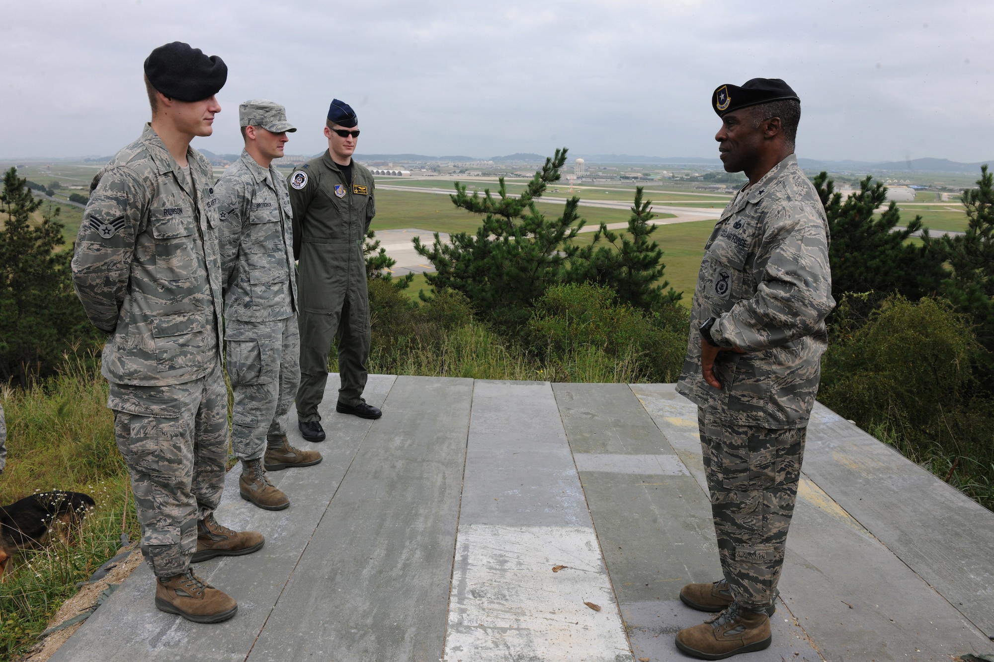 KUNSAN AIR BASE, Republic of Korea -- Brig. Gen. Jimmy McMillian, Director of Security Forces, Deputy Chief of Staff for Logistics, Installations and Mission Support, Headquarters U.S. Air Force, Washington, D.C., receives a briefing from Airmen of the Wolf Pack here Sept. 13. Three Airmen from different squadrons were selected to brief McMillian on the three Wolf Pack mission statements. (U.S. Air Force photo/Senior Airman Brittany Y. Bateman) 

