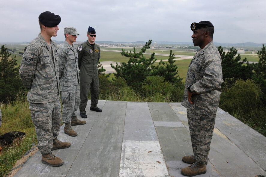 KUNSAN AIR BASE, Republic of Korea -- Brig. Gen. Jimmy McMillian, Director of Security Forces, Deputy Chief of Staff for Logistics, Installations and Mission Support, Headquarters U.S. Air Force, Washington, D.C., receives a briefing from Airmen of the Wolf Pack here Sept. 13. Three Airmen from different squadrons were selected to brief McMillian on the three Wolf Pack mission statements. (U.S. Air Force photo/Senior Airman Brittany Y. Bateman) 