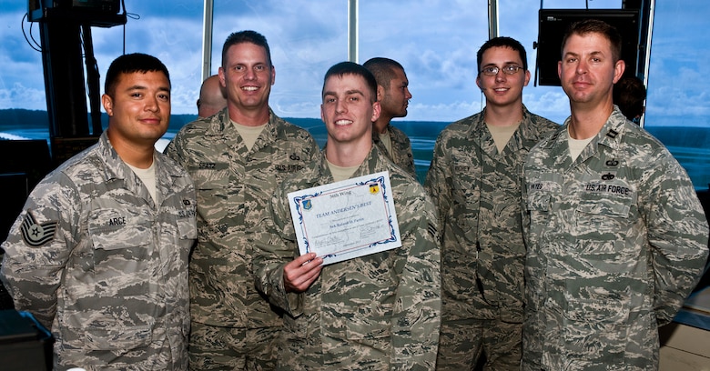 ANDERSEN AIR FORCE BASE, Guam—Senior Airman Roland Partin, 36th Operations Support Squadron air traffic controller, was awarded Team Andersen's Best here, Sept. 15. Andersen's Best is a recognition program which highlights a top performer from the 36th Wing. Each week, supervisors nominate a member of their team for outstanding performance and the wing commander presents the selected Airman/civilian with an award. (U.S. Air Force photo by Senior Airman Benjamin Wiseman/Released)