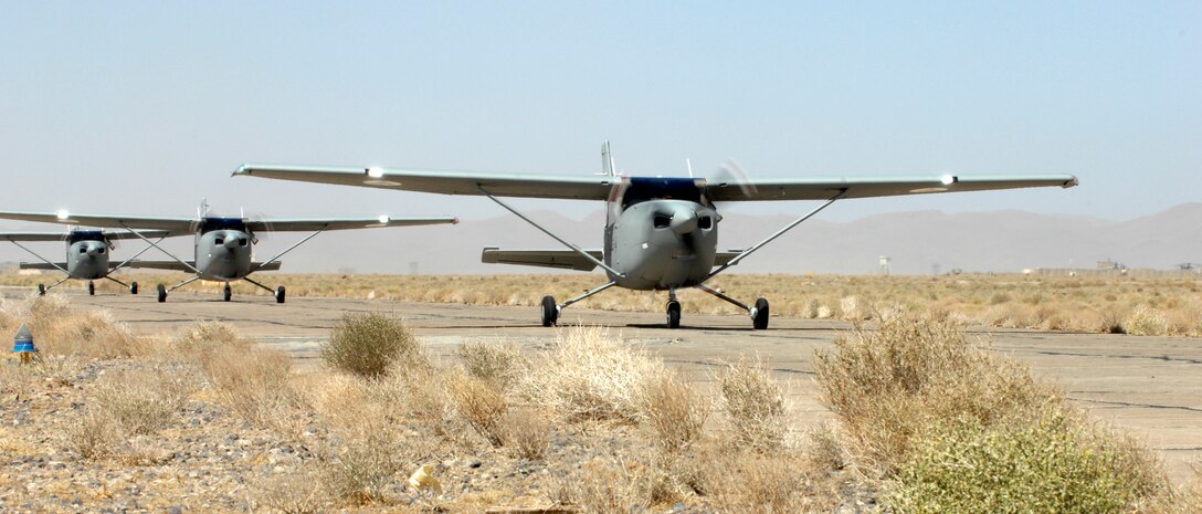 Three Afghan Air Force Cessna 182 Turbos arrive at Shindand Air Base September 18, 2011. With undergraduate pilot training slated to begin at Shindand in December, the trainer aircraft will provide a valuable training tool to facilitate formal flight training.  Three more C-182T's are expected to arrive in Shindand later this month.  (U.S. Air Force photo by Staff Sgt. Matthew Smith) 