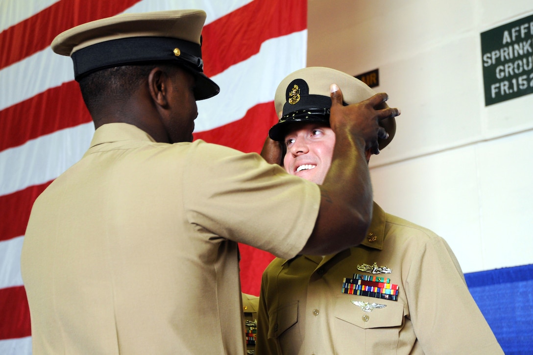 U.S. Navy Chief Petty Officer Matthew Rice receives his chief ...