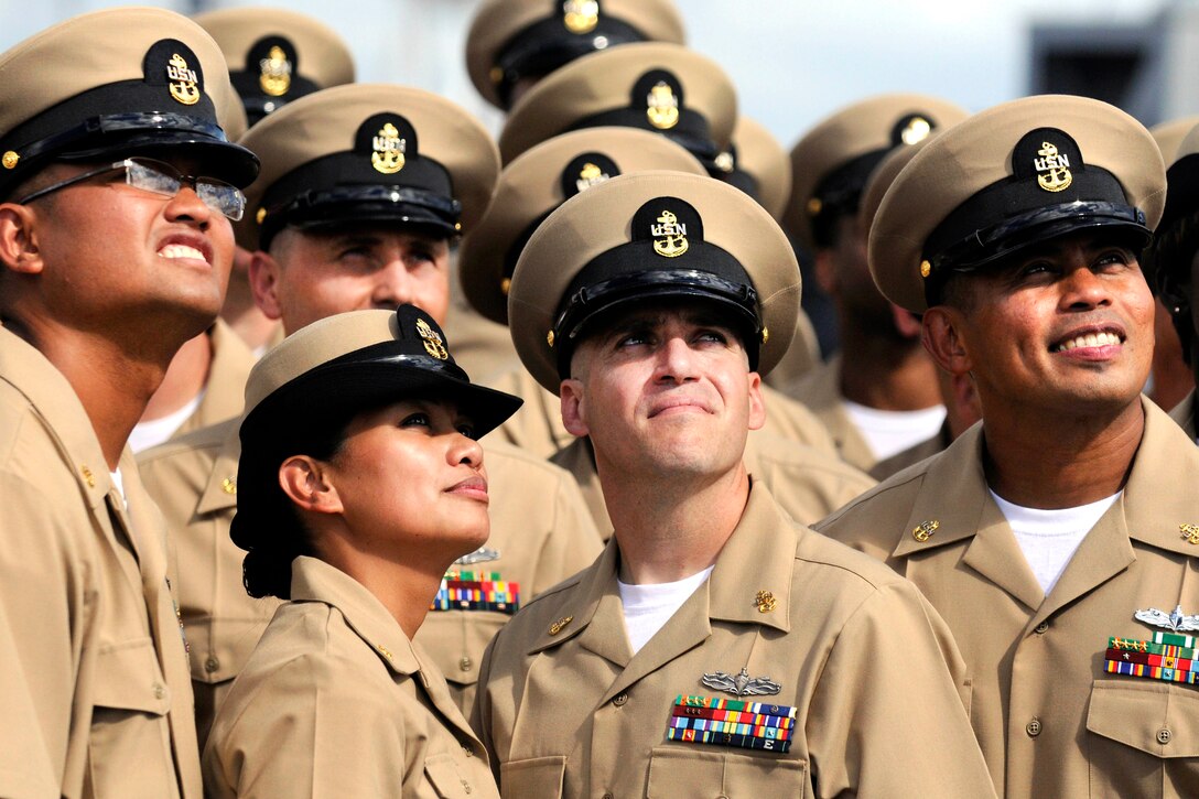 Newly pinned U.S. Navy chief petty officers pose for a group photograph