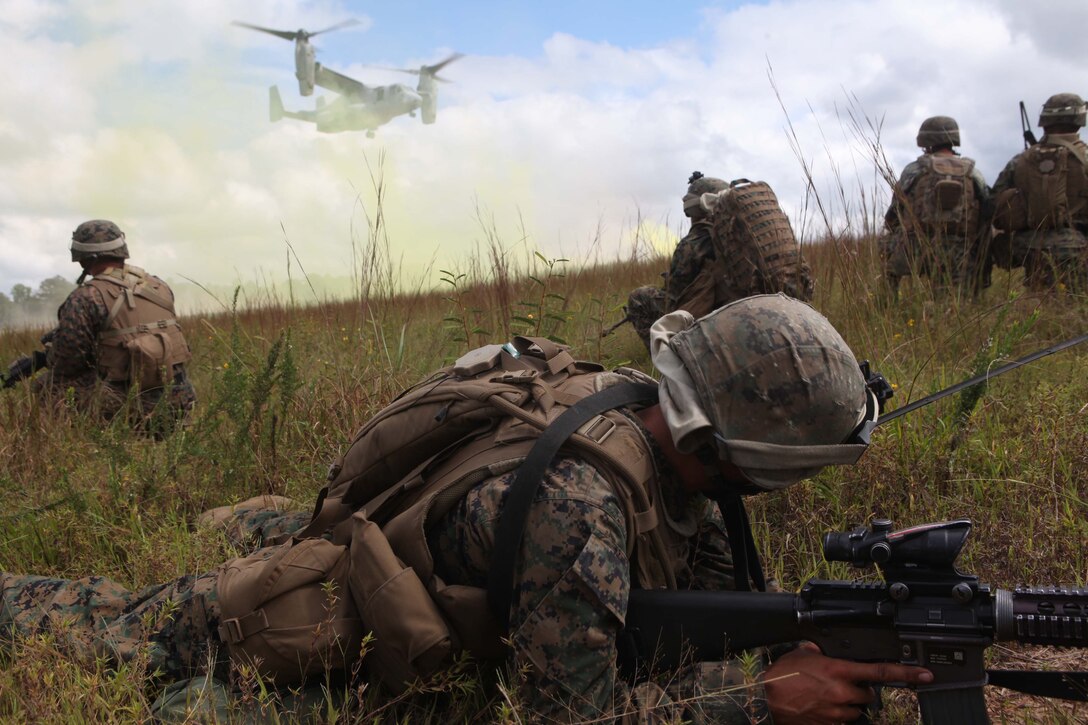 Marines from Bravo Company, 1st Battalion, 2nd Marine Regiment, post security an MV-22 Osprey lands near Fort Pickett's Cherry Villiage, Va., Sep. 19, 2011. More than 900 Marines and Sailors are taking part in the Deployment for Training exercise at Fort Pickett, Sept. 6-23. The battalion is scheduled to attach to the 24th Marine Expeditionary Unit as its Battalion Landing Team a few days after the training.