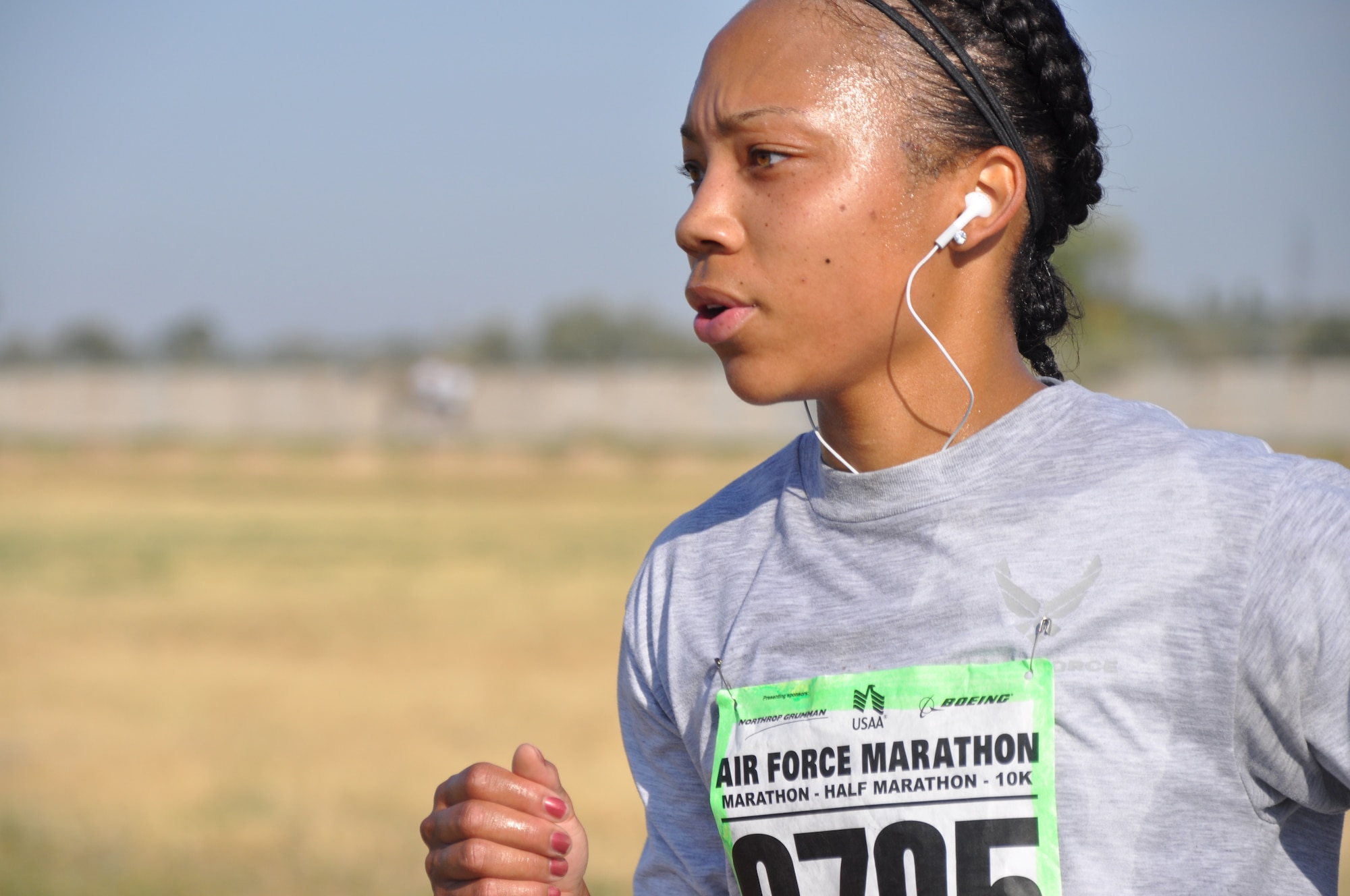 Staff Sgt. Merissa Pough maintains a steady pace as she runs in the Air Force Deployed Location 10k, Half and Full Marathons at the Transit Center at Manas, Kyrgyzstan, Sept. 17. She is deployed to the 376th Expeditionary Civil Engineer Squadron Escort Flight from Keelser Air Force Base, Miss. (U.S. Air Force photo/Staff Sgt. Brianne Smith)