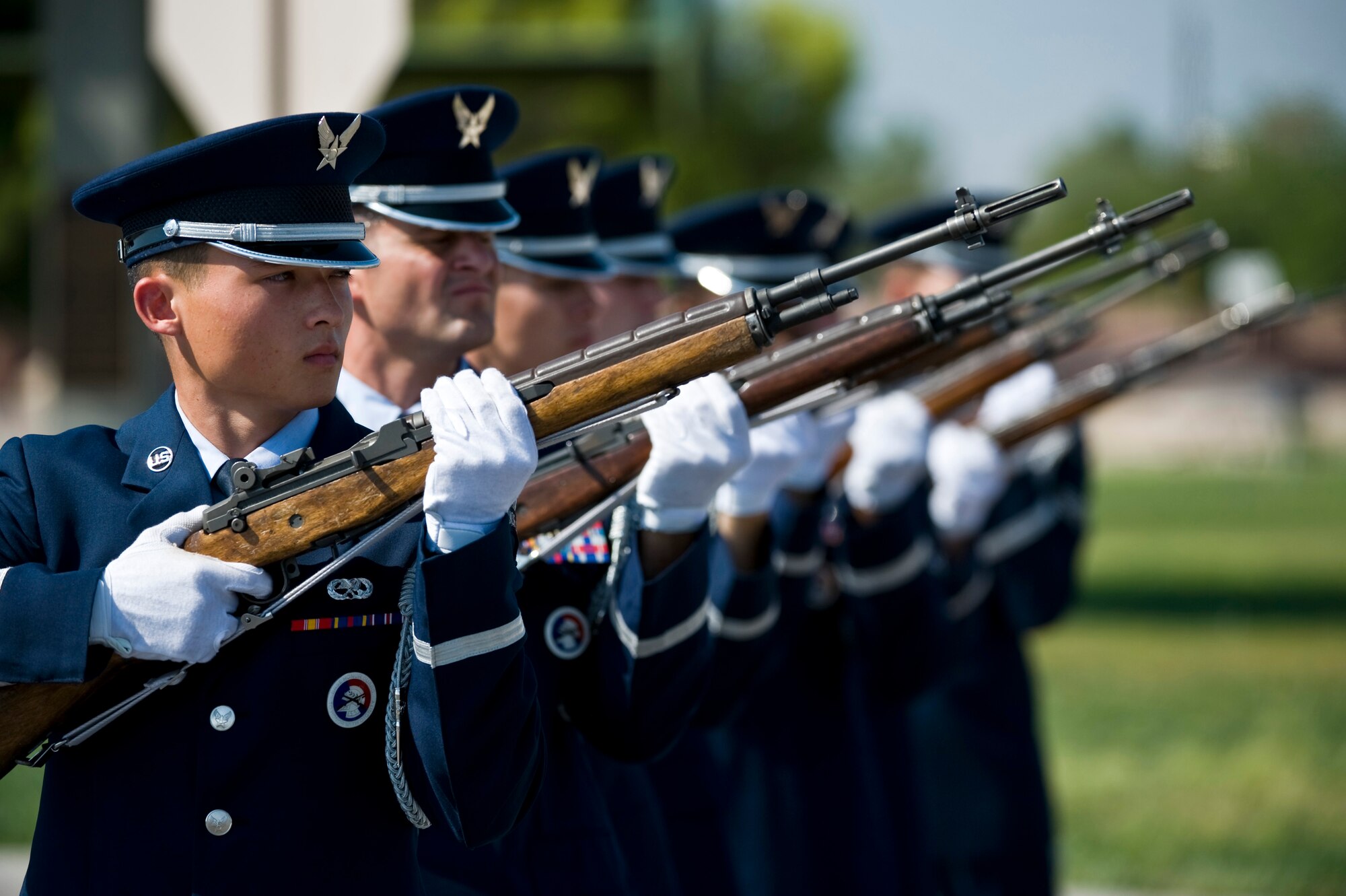U.S. Air Force Nellis Honor Guard firing party performs a 21-gun salute during the National Prisoner of War/Missing in Action Recognition Day ceremony Sept. 16, 2011, at Freedom Park on Nellis Air Force Base, Nev. The ceremony included the dedication of a POW/MIA ceremonial wreath, the reciting of names of Nevadans who are war prisoners and those who are still missing, a 21-gun salute by a rifle firing party and an F-16 Fighting Falcon flyover. (U.S. Air Force photo by Senior Airman Brett Clashman/Released)